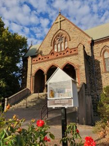 Image of church with tiny art gallery in front.